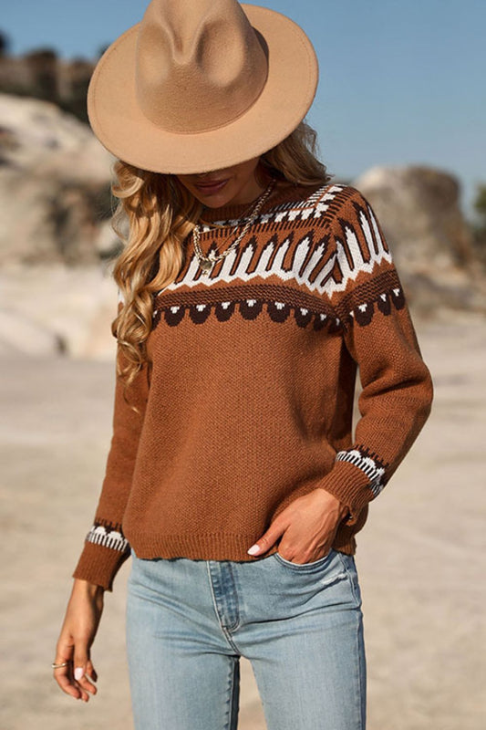 A woman standing outdoors wearing a fairisle-inspired boho pullover sweater