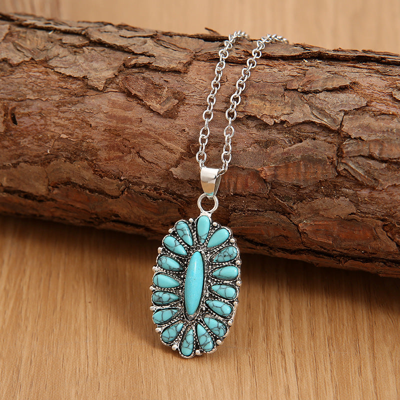 A traditional Western-inspired turquoise cluster pendant in faux turquoise