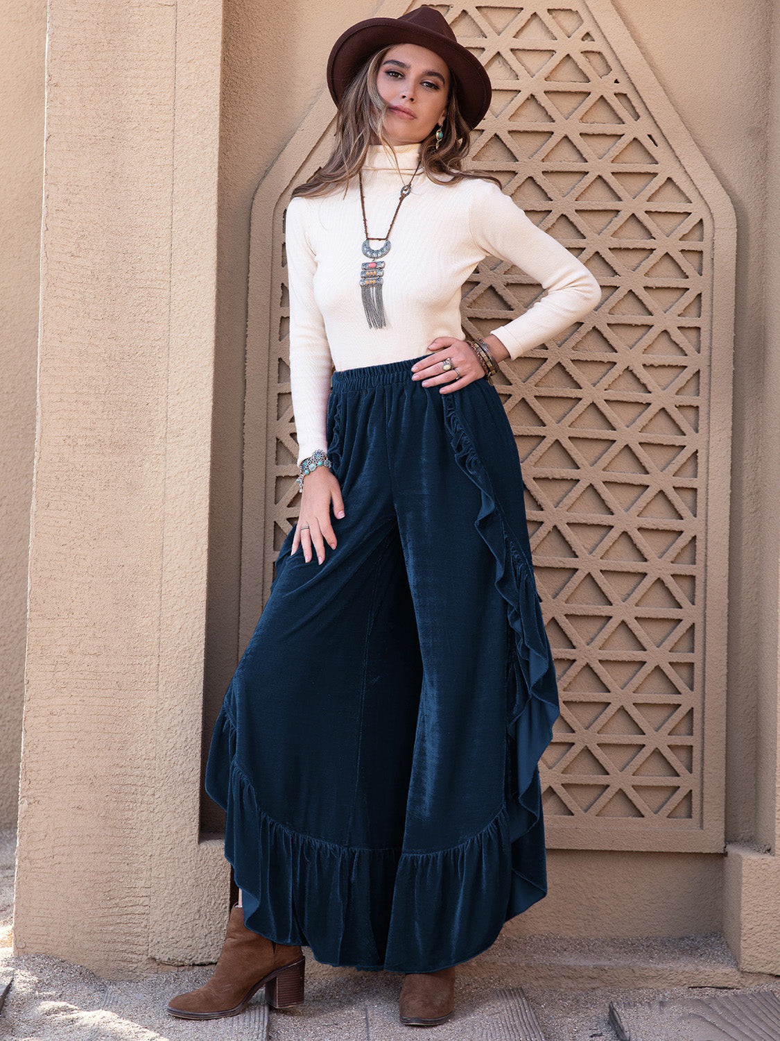 A woman wearing a pair of Mira wide leg culotte pants