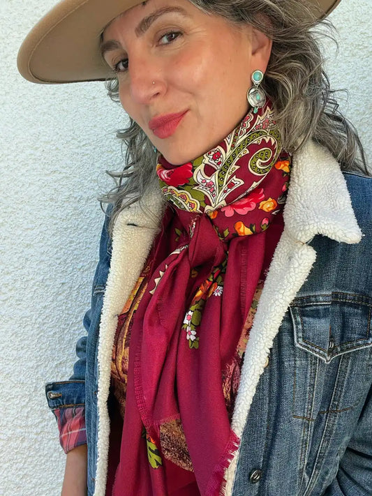 A woman wearing a Baltic style scarf as a wild rag with a denim jacket