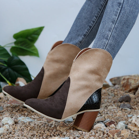 A pair of color block Western-inspired suedette ankle boots.