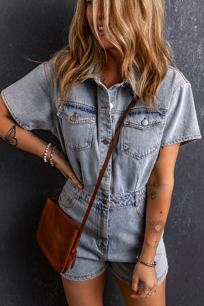 A woman wearing a light wash denim romper