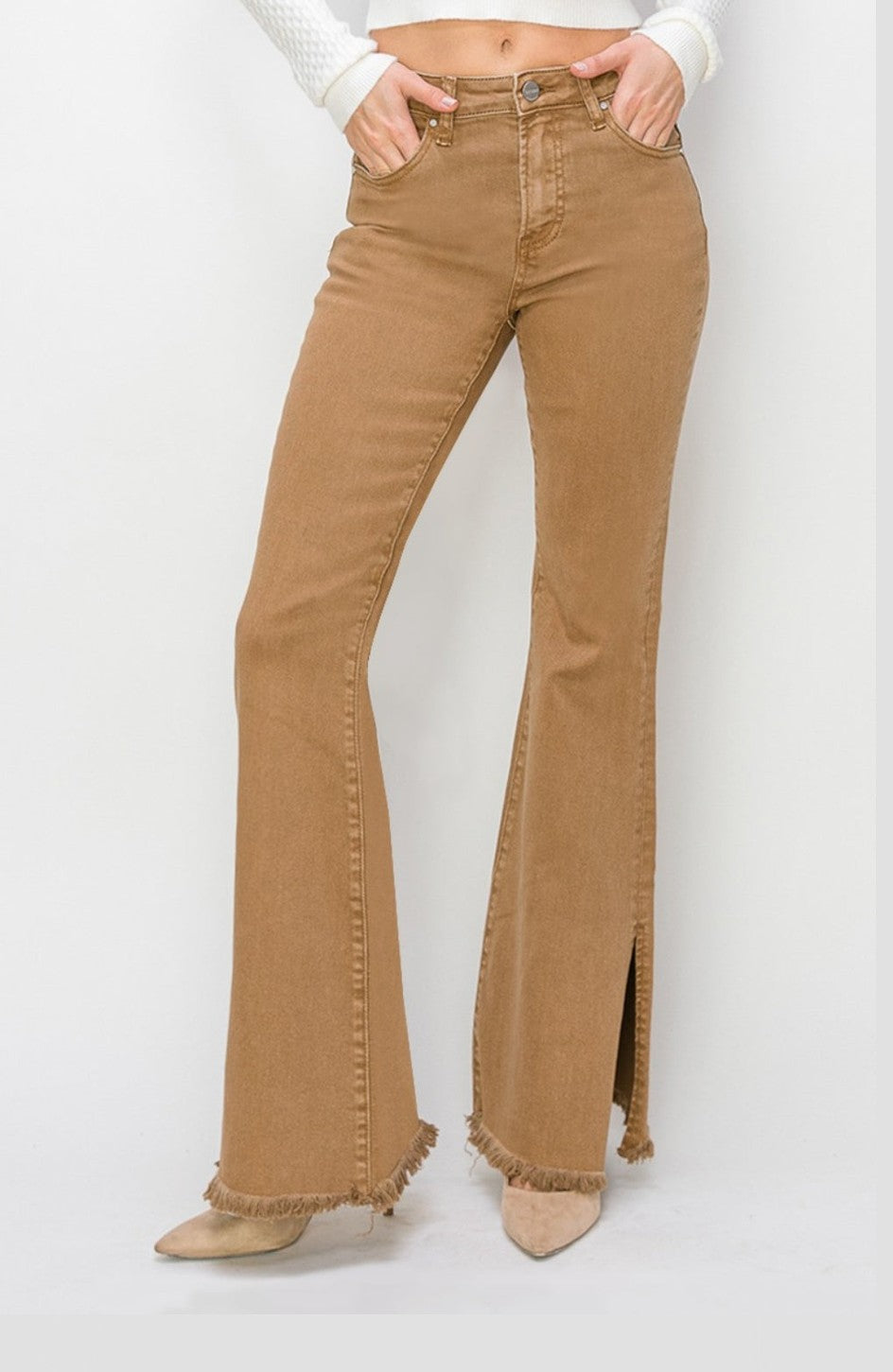 A front lower view of a woman wearing a pair of brown denim Durango slit flare jeans made by Risen.