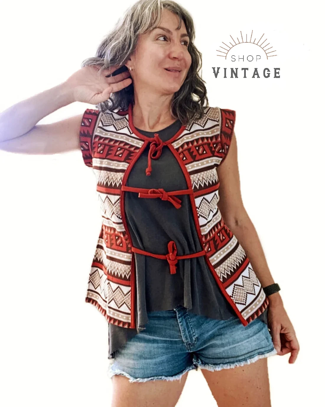 A woman wearing a 1970s era vintage Western style vest